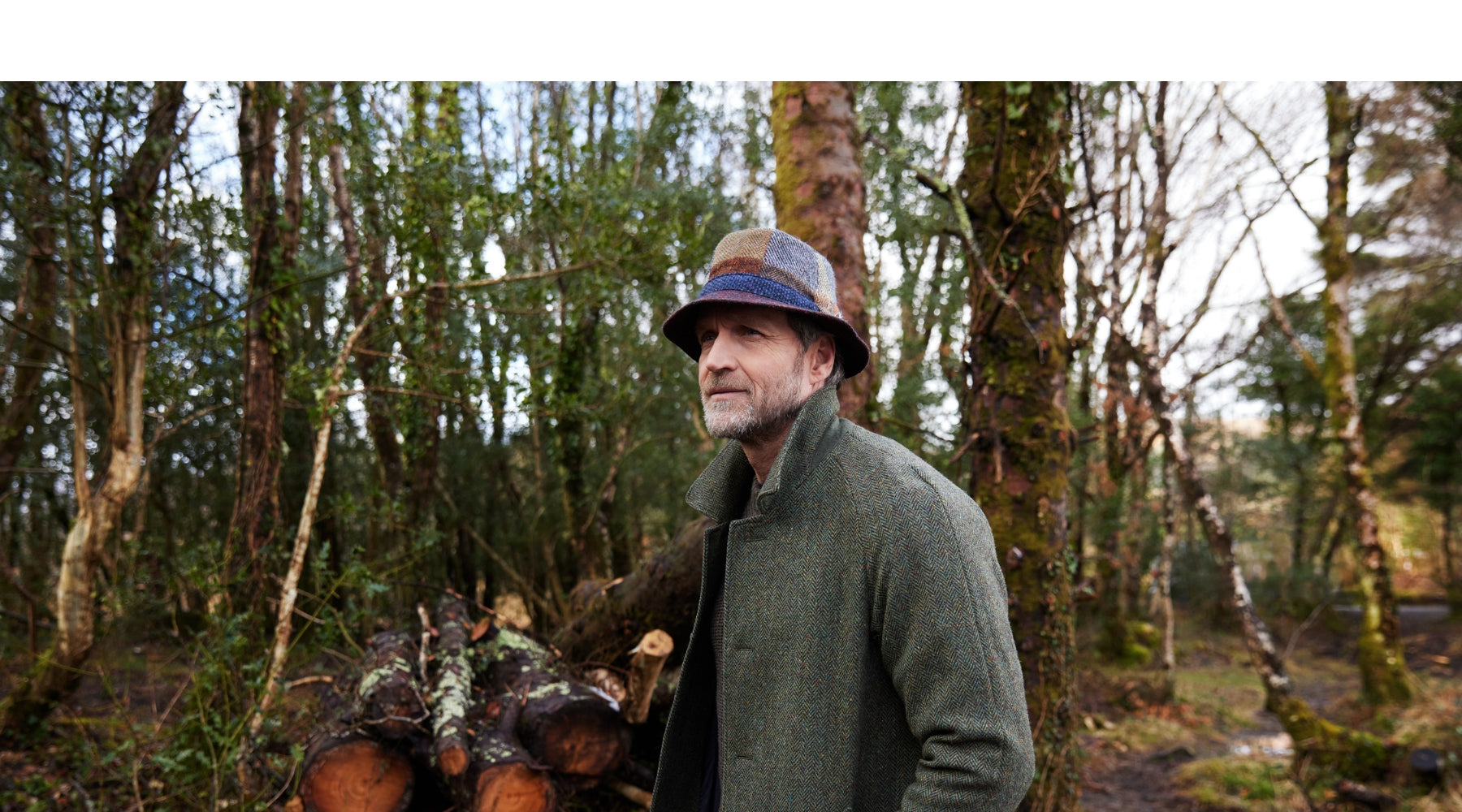 Finn wearing a Patchwork Walking Hat with vibrant colours.