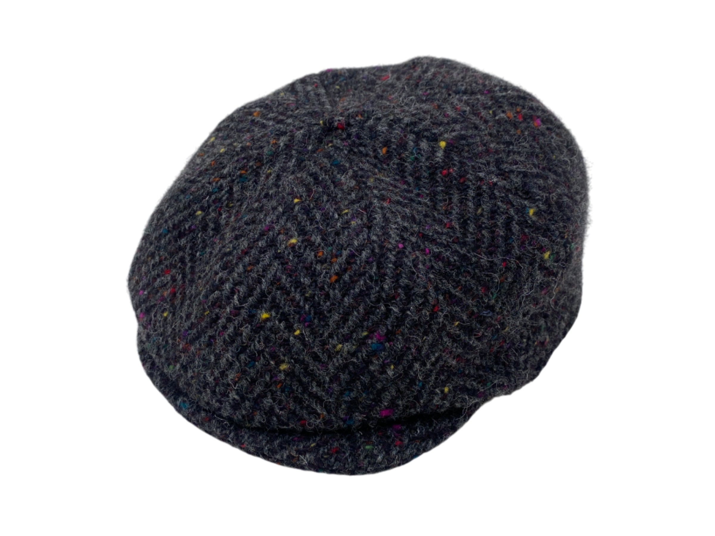 The Hanna Hats Connery Cap Tweed is a dark gray newsboy cap with a herringbone pattern and colorful flecks, inspired by classic style and Sean Connery, shown on a white background.