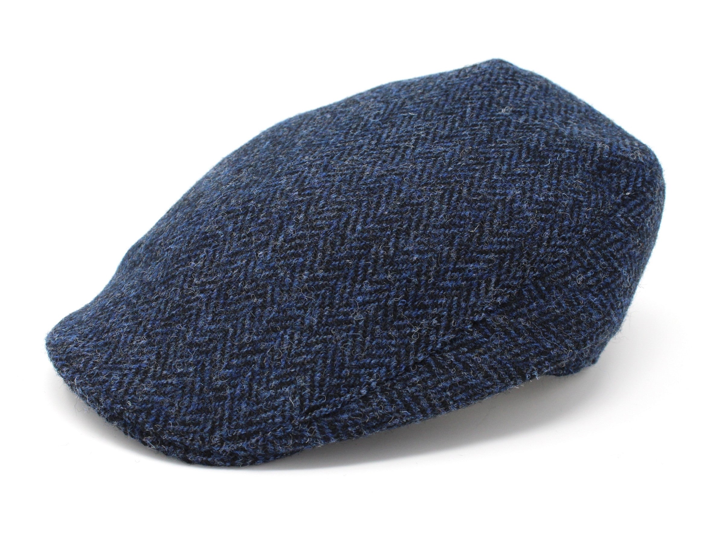 A Hanna Hats Donegal Touring Cap Tweed in blue herringbone with a tailored fit is displayed against a white background.