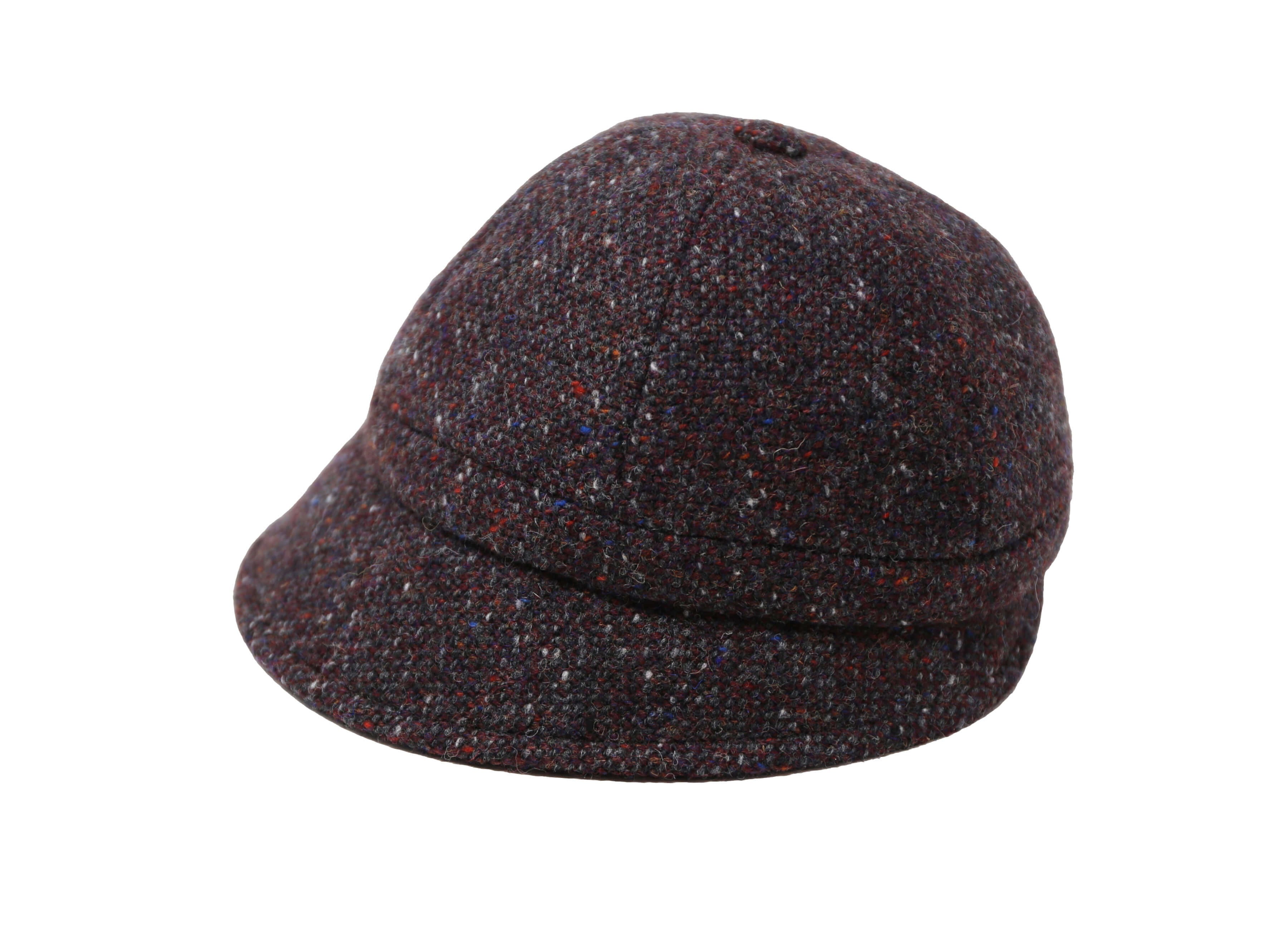 The Hanna Hats Slieve League Hat Tweed features brown tweed, a short brim, and a rounded crown, inspired by Donegal's rugged coastline and shown on a white background.