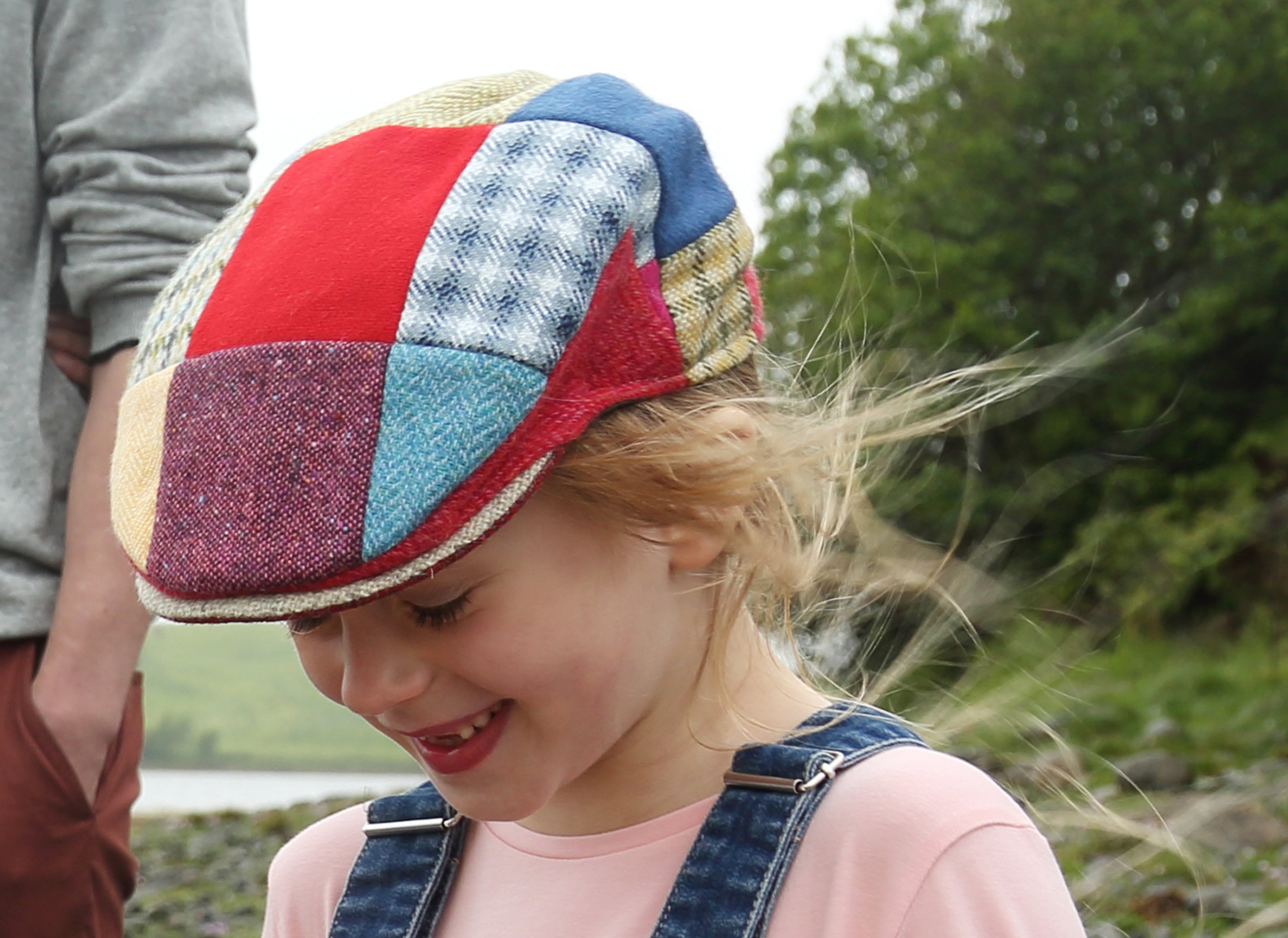 Emmy wearing Hanna Hats Children's Cap Bright Patchwork Tweed