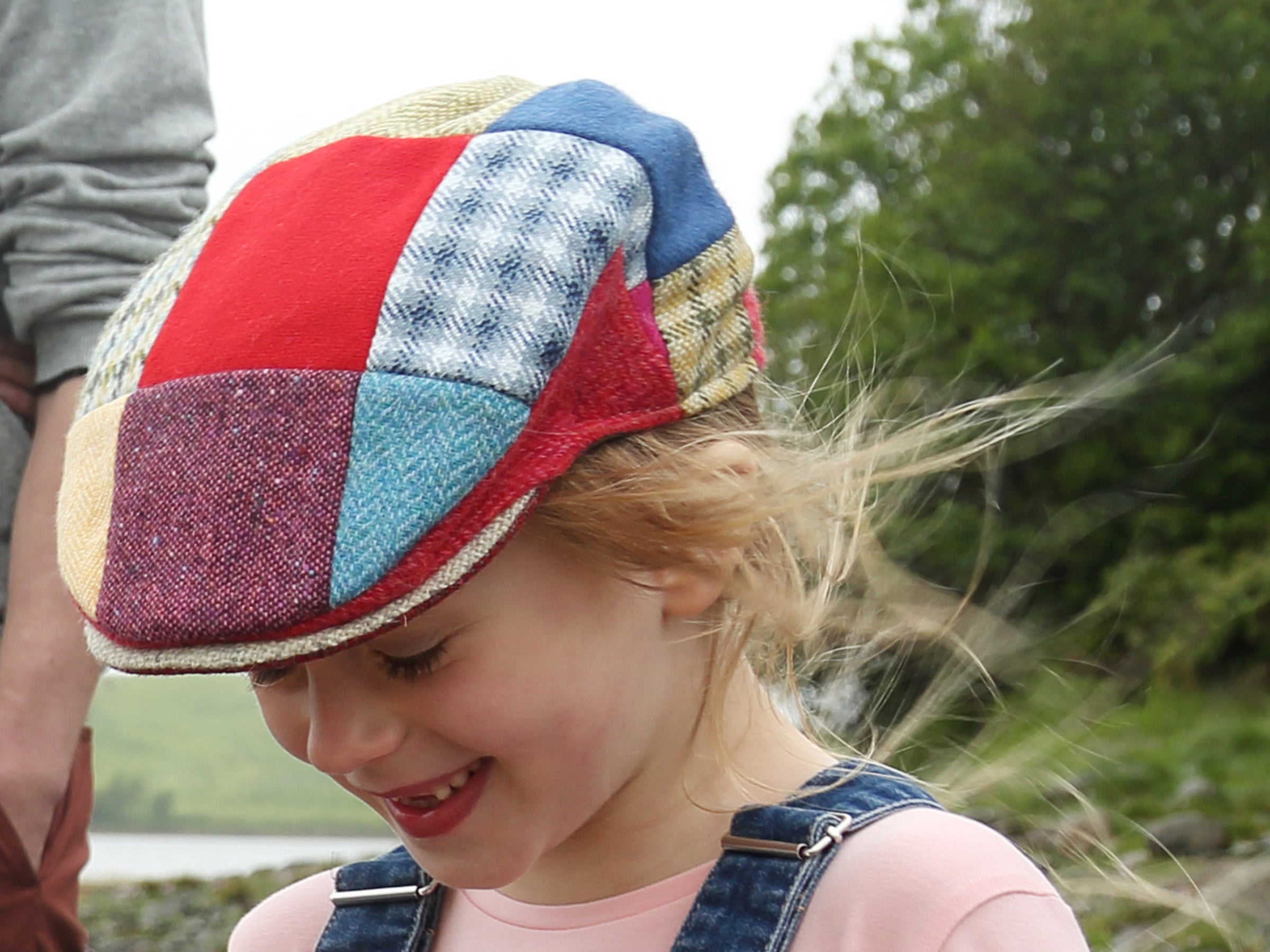 Emmy wearing Hanna Hats Children's Cap Bright Patchwork Tweed